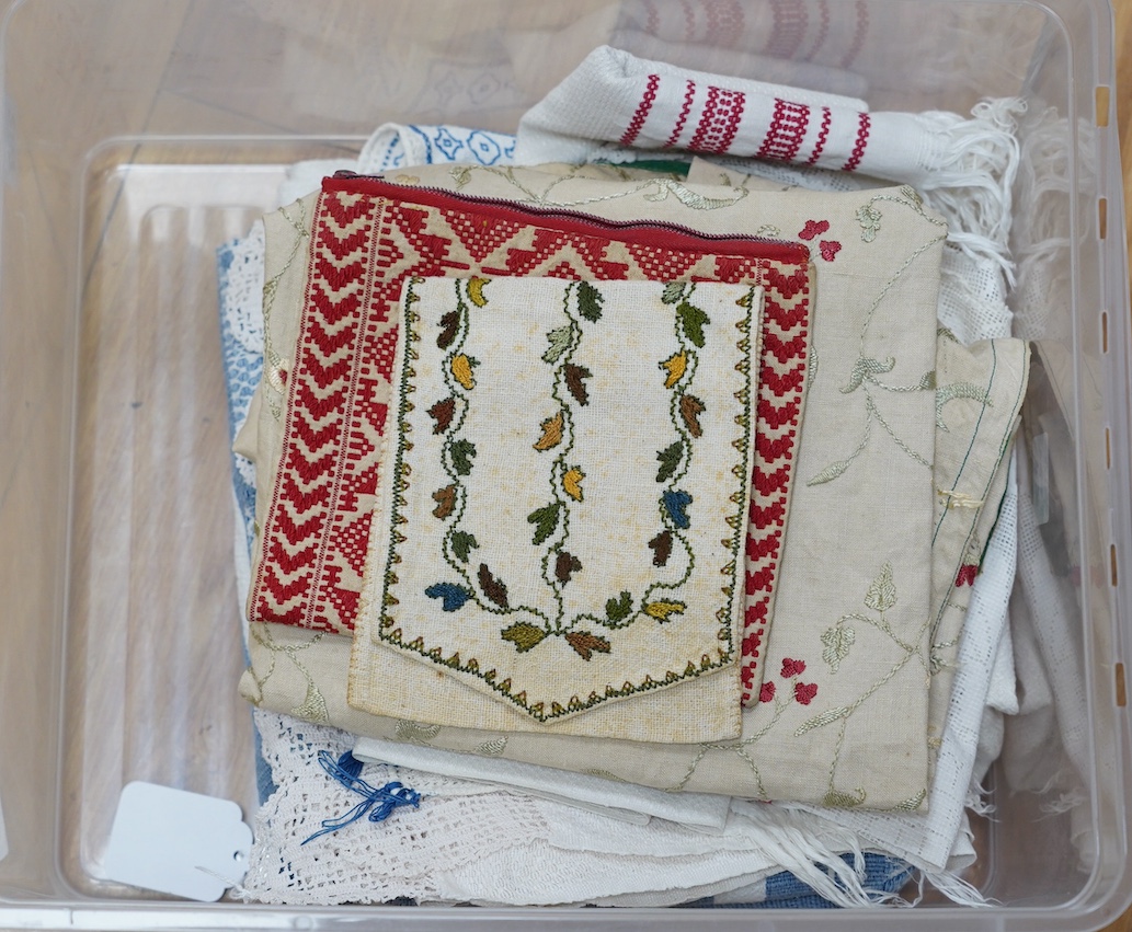 A 19th century embroidery on linen, a decorative hand towel in blue cross stitch, a finely worked table centre and a collection of handkerchiefs, etc. Condition - fair